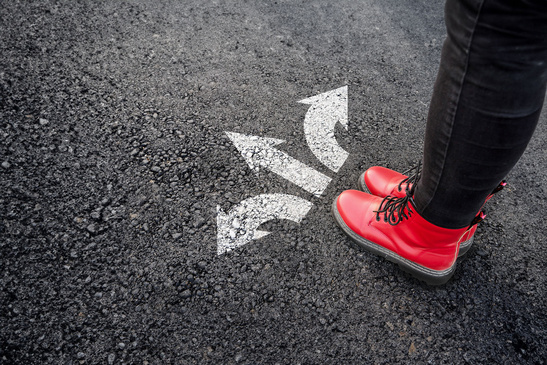 Person with red boots stopping at three arrows